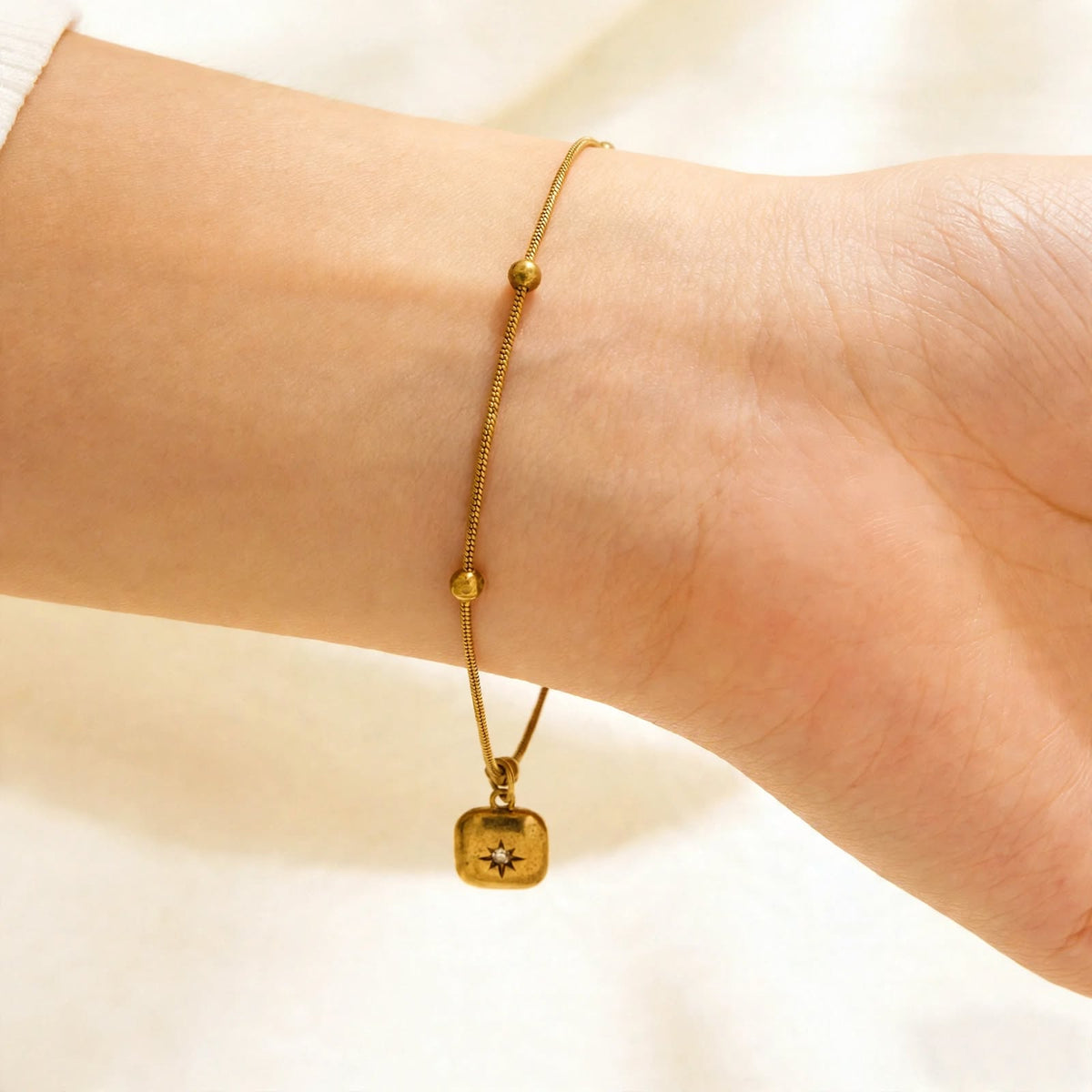 Golden Starburst Square Charm Bracelet – HouseOfMirra